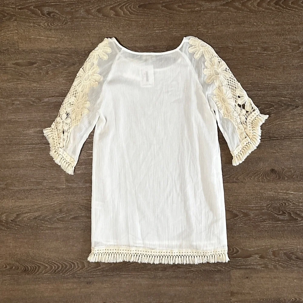 Umgee
Mini dress with floral crochet sleeves and fringe detail size S Small NWT - Picture 8 of 13